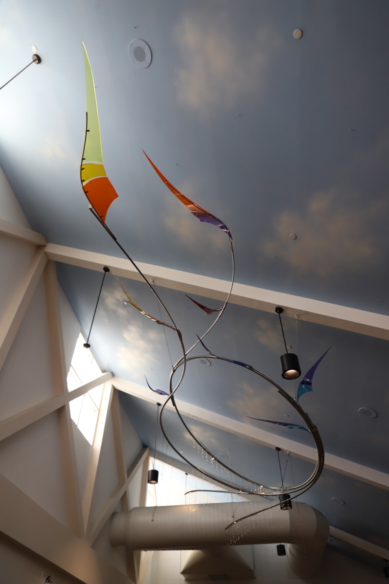 Thornton SkyDance by Seth Palmiter  Image: Photo of suspended sculpture made of metal, colorful acrylic, and Swarovski crystal elements.