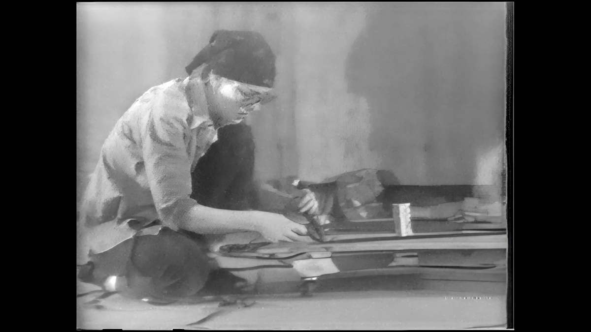 Magic Carpet 1976 by Alan Powell  Image: Alan Powell’s artistic collaborator and wife of nearly thirty years, Connie Coleman, worked for the Rhode Island Council on the Arts as craftsman-in-residence from 1975 to 1976. Coleman’s background in textile artistry and new forays into video art in collaboration with Powell led to Coleman being commissioned by a local PBS affiliate, and Magic Carpet documents this process, and encapsulates the spirit of Coleman and Powell’s long partnership. The play and experimentation; cutting-edge technology matched against the elements of nature; and fragments of everyday life turned into performance art are all captured in the 1976 short. In Magic Carpet, Coleman weaves recycled NASA computer tape into a three-dimensional structure, working with it as she would a loom. The structure was to be tethered to a dozen weather balloons and stakes, then launched, sent off to float over Roger Williams Park. During installation, the wind speed was so powerful that the three-dimensional carpet pulled loose, chartering its own course into East Providence. 