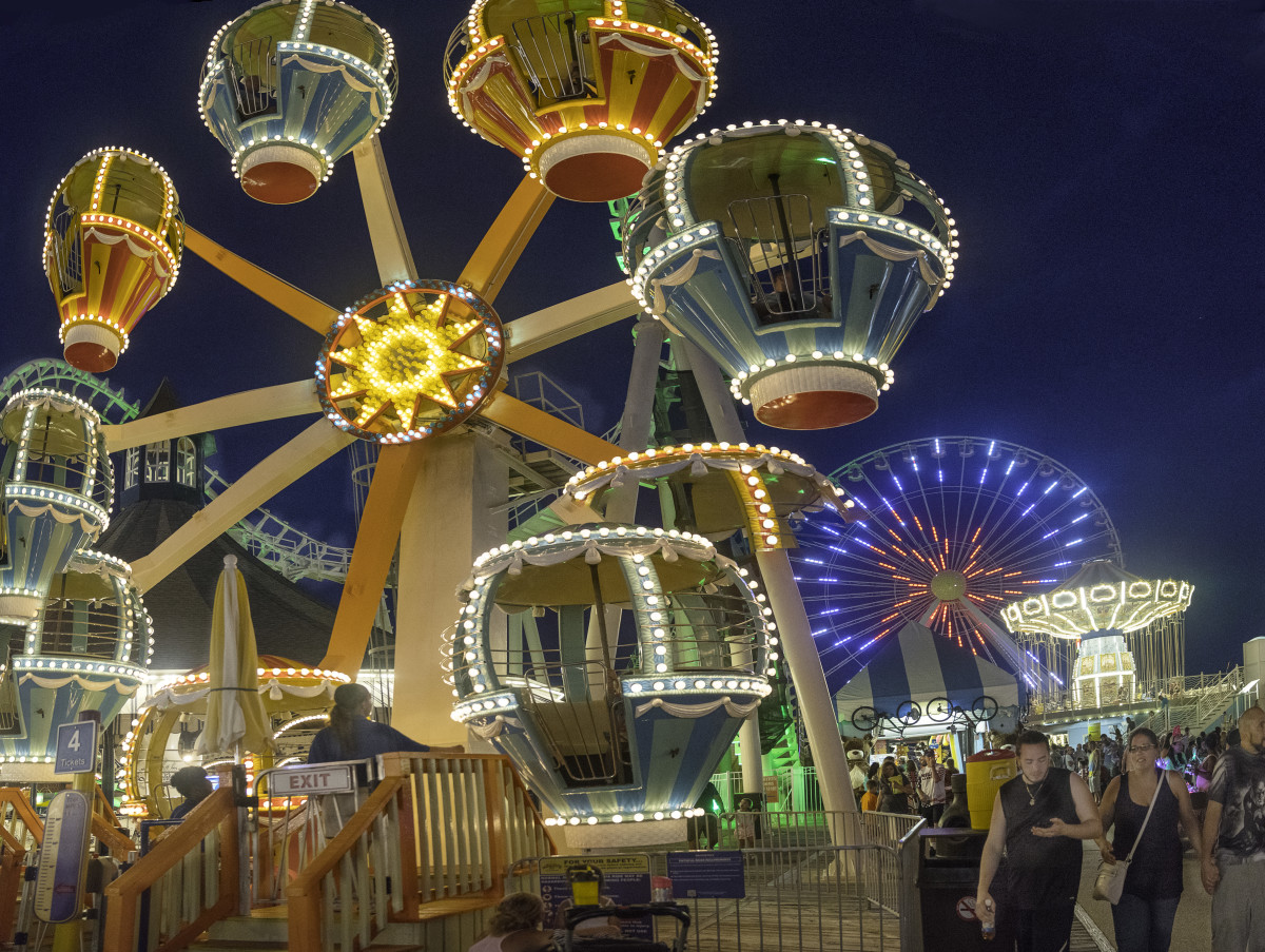 Amusement park rides at night by Alan Powell 
