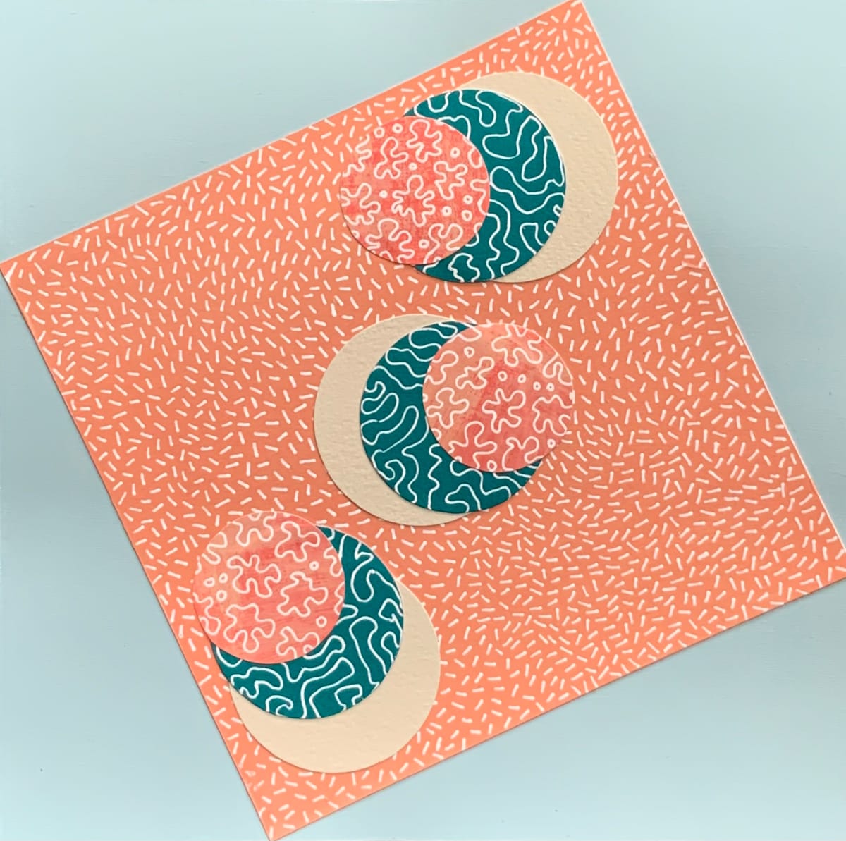 Dots 32, Baby Blue + Peach Pattern, Tan, Teal & Salmon Pattern by Suzanne Gibbs  Image: Dots 32, Baby Blue + Peach Pattern, Tan, Teal & Salmon Pattern, Mixed Media Work on Paper, 8 x 8 inches.