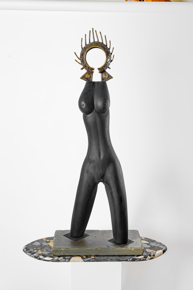 Black Beauty  Image: Sensuous figure carved of salvaged swamp elm, adorned with a Tikar bronze currency from Cameroon, West Africa, on base. 