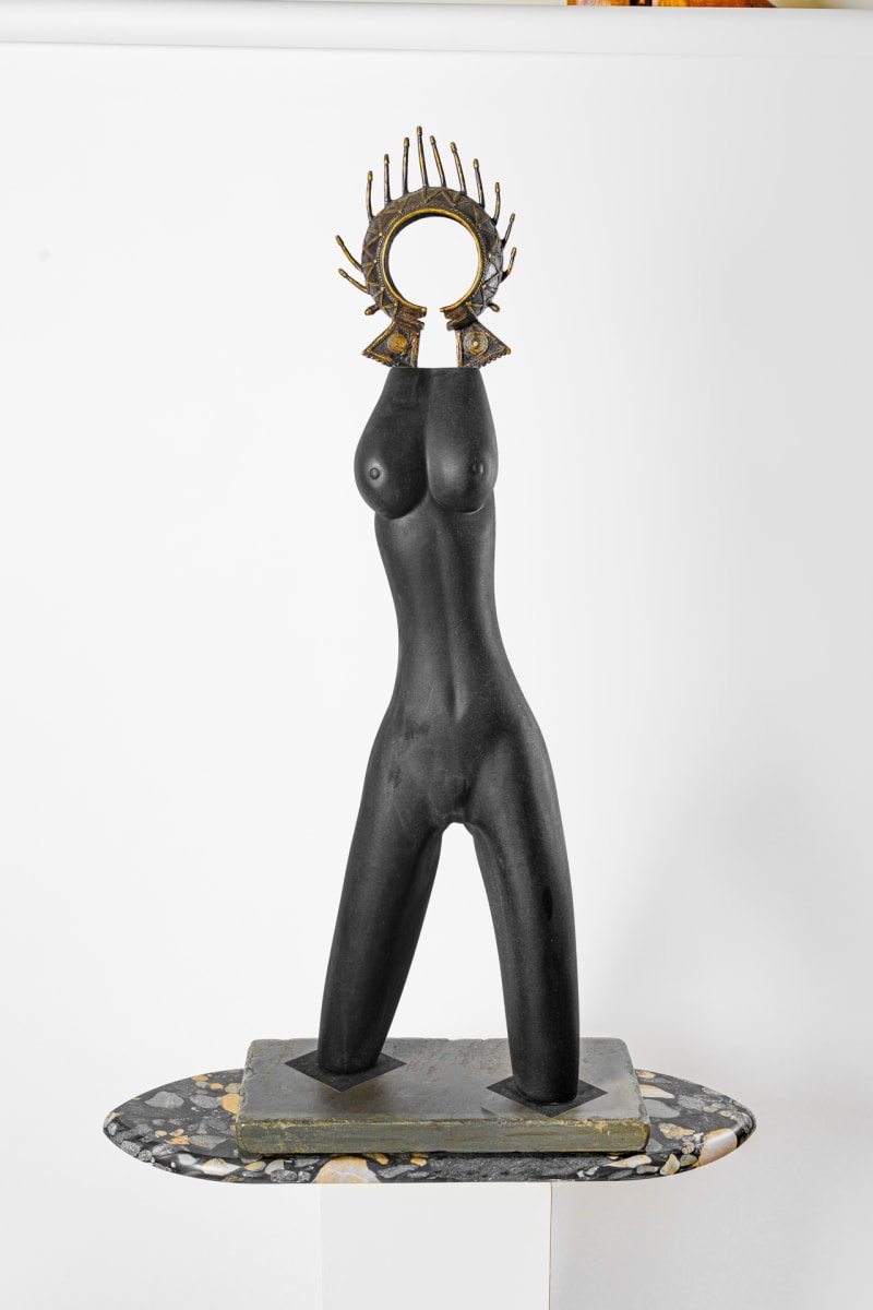 Black Beauty by Rigsby Frederick  Image: Sensuous figure carved of salvaged swamp elm, adorned with a Tikar bronze currency from Cameroon, West Africa, on base. 