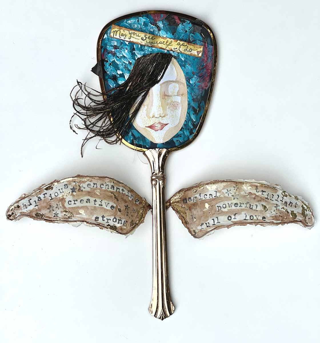 Reflection by Lea K. Tawd  Image: "Reflection," feathers, paper, acrylic, wire, ink graphite and metal leaf on reclaimed mirror. 13 x 12.5 x 2.75" by Lea K. Tawd
