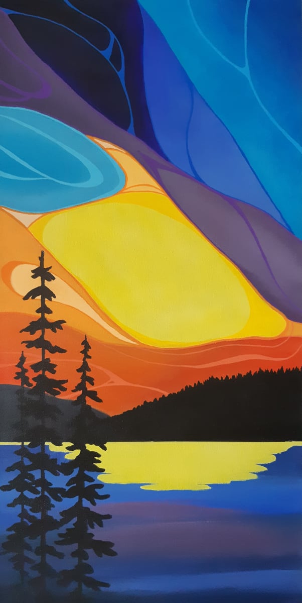 Beauty in the Sky  Image: The beautiful sunset stretches high into the sky above a lake surrounded by pine forests.