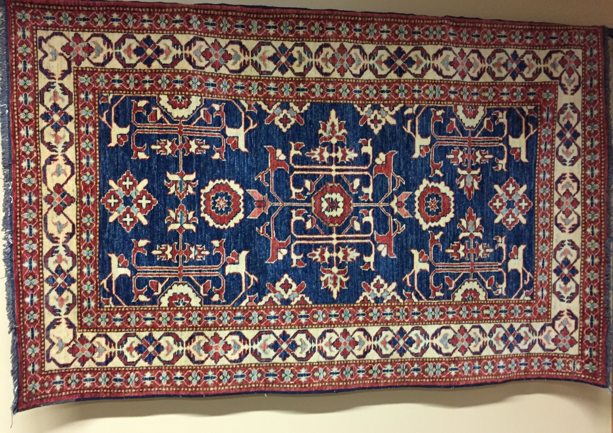 Pakistani Rug (Blue interior, rust/cream border) by Unknown 