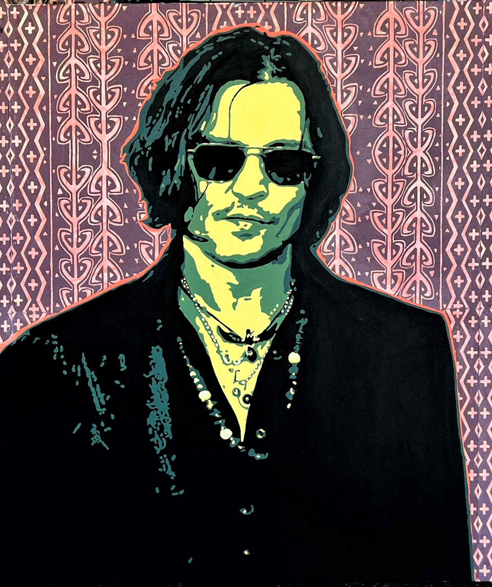 Black Lace and Broken Toys by John McCaskill  Image: Black Lace and Broken Toys captures the dark magnetism and mythic eccentricity of Johnny Depp’s film persona. With a palette of eerie greens and shadowed blacks, his stylized portrait emerges with cinematic stillness—equal parts rock star and spectral dandy. The patterned woodblock background, laced with ornamental repetition in mauve and blush, echoes both the baroque whimsy and quiet danger of the characters he so often inhabits.  There’s a sense of carefully assembled chaos here—beads, buttons, and layered necklaces hint at costume and identity, while his expression holds the cool detachment of someone who’s always halfway in another world. The piece speaks to those strange, broken, and beautiful figures that live on the fringes of fantasy and reality, haunted by memory and dressed for drama.