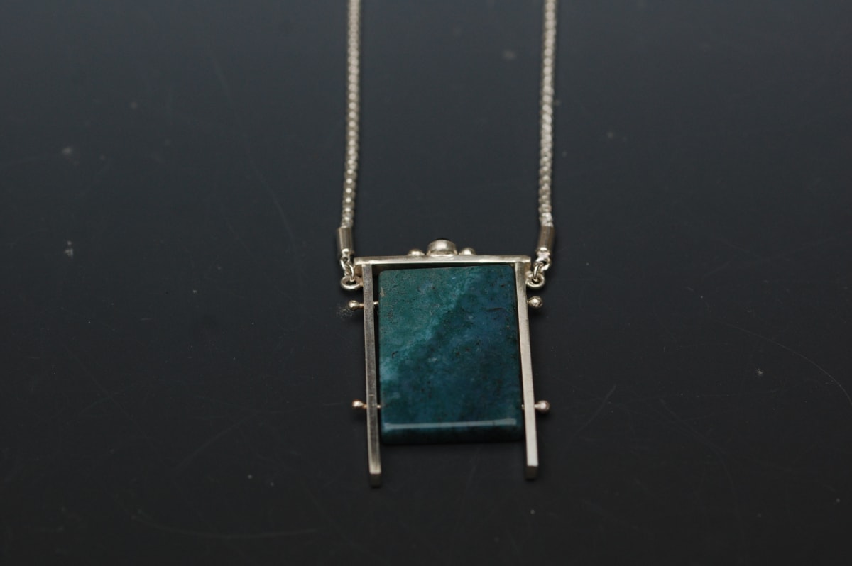 Bluegreen Stone w/Black Onyx by Susan Baez  Image: 1" x .75" x 18" chain