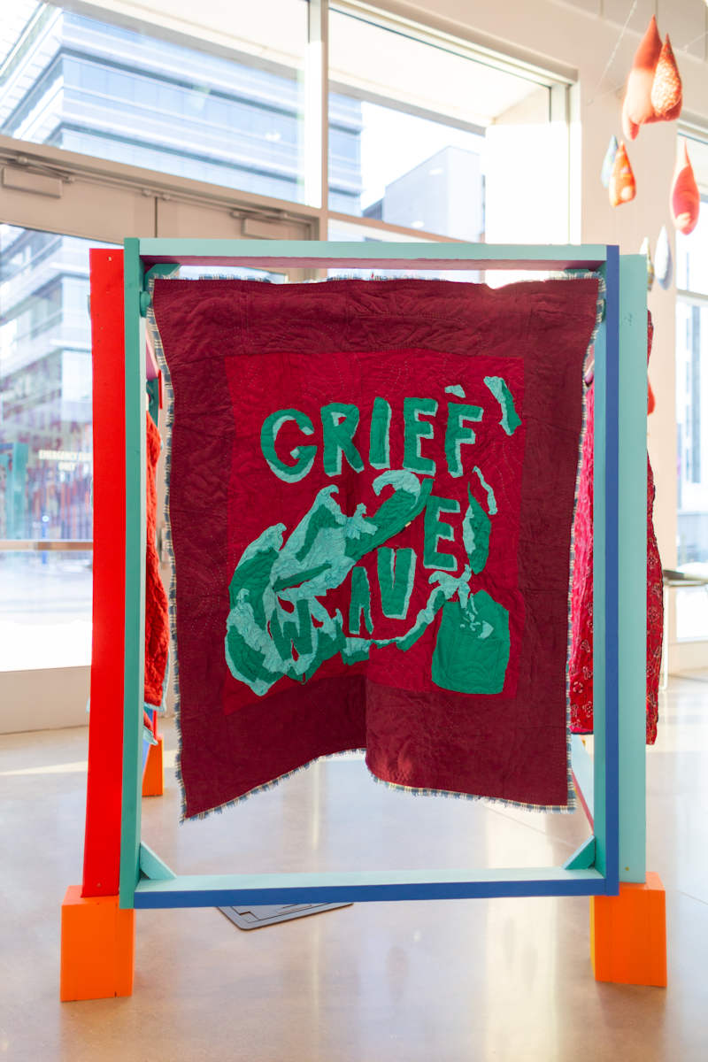 Grief Wave Quilt #1 -#3 by Jennifer Bastian  Image: #1: Not For Sale: Cotton and polyester skirts and pants, cotton tablecloth, scrap fabric, thread 40 x 46”