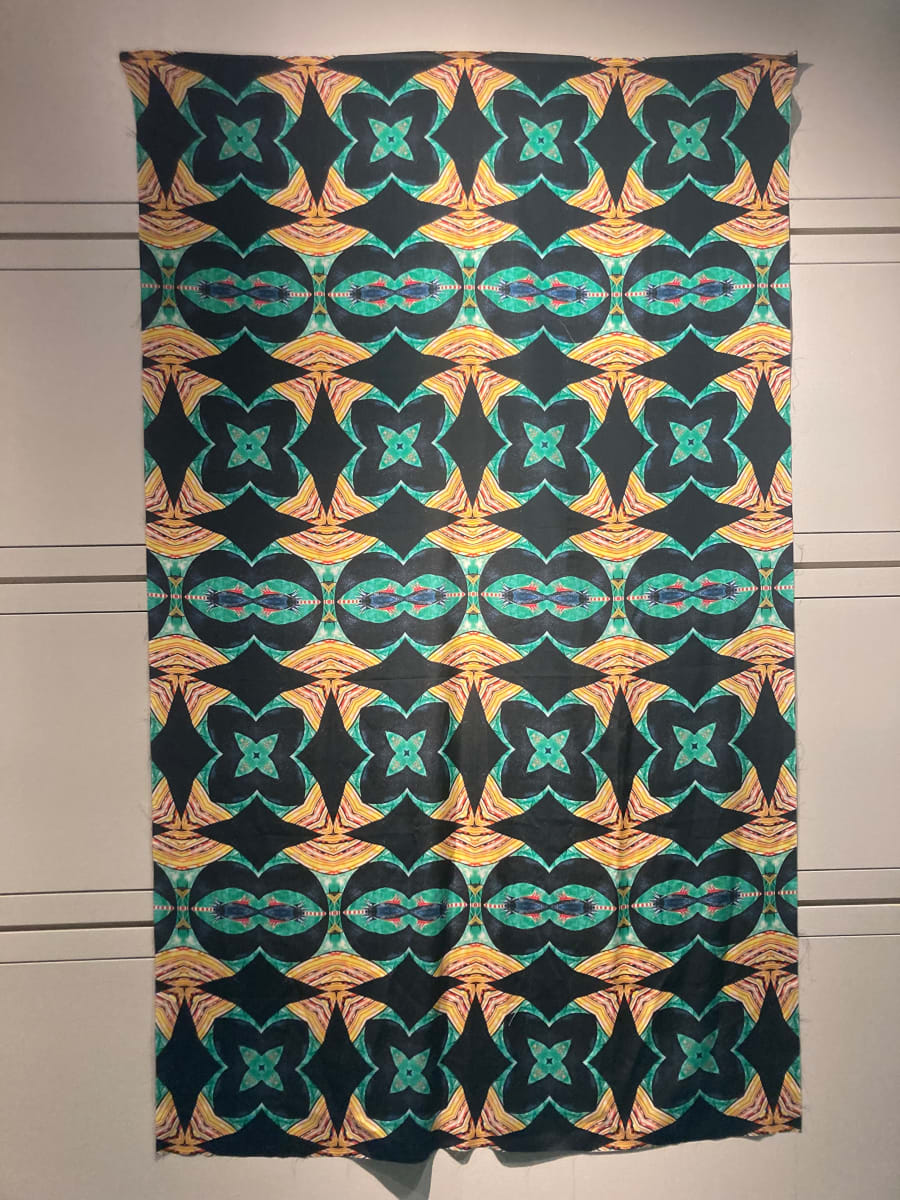 Tapestries of Hope 6  Image: Using detailed photographic images taken from the artwork created by kids and families, Kristina designed patterns with the help of an app called Repper https://repper.app. This app takes the imagery and provides an infinite amount of possibilities, producing a tile that can be made into a larger repeating pattern. These designs are one-of-a-kind; they began from a unique, individual piece of art. These patterns were then printed on silk crepe fabric. Each panel is 48 x 78 inches. 