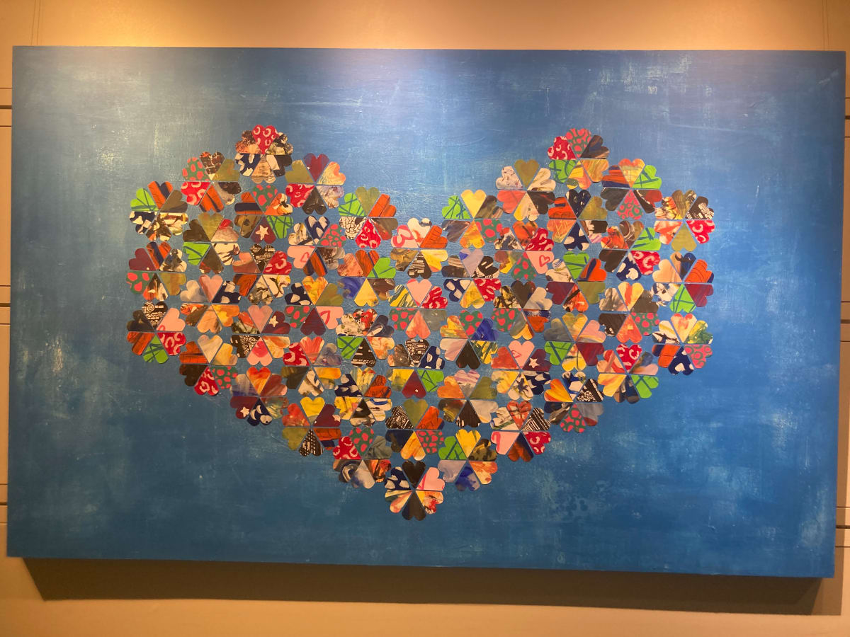 Hearts of Hope by Kristina Davies  Image: Being a process-based painter whose primary focus is abstract expressionism, Kristina wanted the families at Brent’s Place to experience the freedom of painting intuitively. She encouraged the participants to paint using gesture, mark-making, music and movement. Using the abstract art and painted papers from these workshops, Kristina then created this larger, mixed-media work on a 5’ by 8’ wood panel, designing a grid of hearts. Each heart comes from a piece of art created by kids and families at Brent’s Place. 