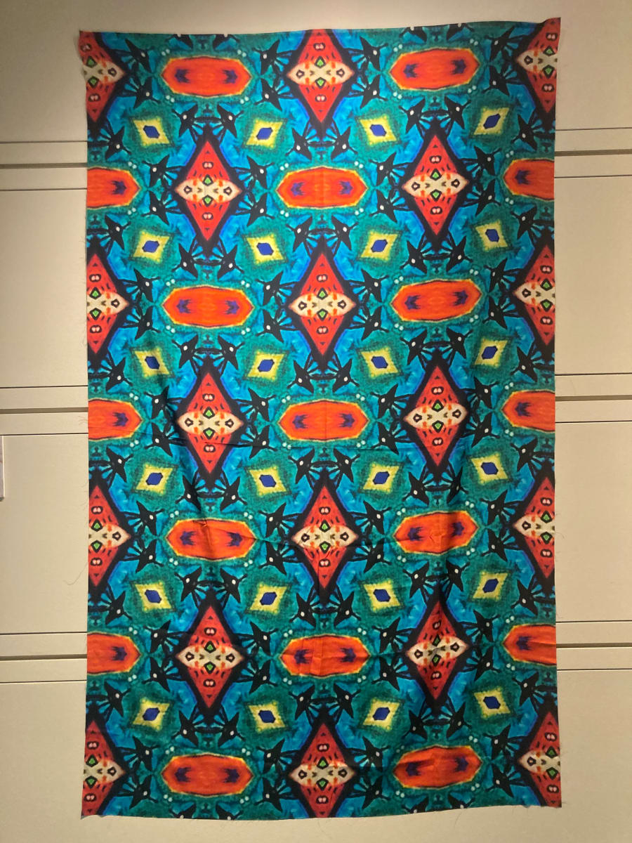 Tapestries of Hope 2  Image: Using detailed photographic images taken from the artwork created by kids and families, Kristina designed patterns with the help of an app called Repper https://repper.app. This app takes the imagery and provides an infinite amount of possibilities, producing a tile that can be made into a larger repeating pattern. These designs are one-of-a-kind; they began from a unique, individual piece of art. These patterns were then printed on silk crepe fabric. Each panel is 48 x 78 inches.   