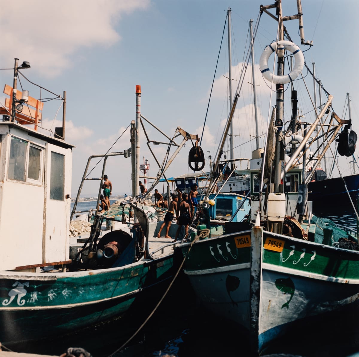 Boys on Fishing Boat (Akko, Israel) by Amie Potsic 