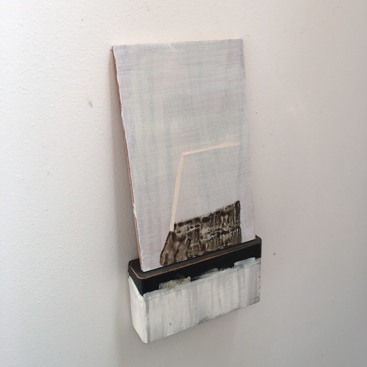 Small, leaning painting on painted  wooden block with tape by MaryAnn Puls 