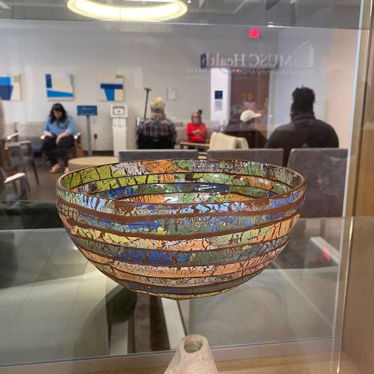 Stephen Biggerstaff by Stephen Biggerstaff  Image: I take nourishment in the belief that a bowl fills me up. Once in the
making, when I am grateful for my nimble hands and clear eyes to
create the vessel; and again, when I know my bowl will hold
sustenance in someone else’s hands. Mostly, though, I make these
bowls to clear my head and connect with my heart. This work is
inspired by the brightly colored and vibrantly patterned rag rugs
throughout my home and the homes of my friends.
These are hearty, open, slouchy vessels that are pieced from strips of
vividly colored porcelain slips laminated onto clay slabs of porcelain,
stoneware, or earthenware and fired up to 2200 degrees. The exterior
of the pieces is left unglazed to impart a tactile grip when holding,
and the interior is glazed in a buttery matte or shiny clear for contrast.
I make work in multiple sizes, small to feed yourself and larger to feed
your family and friends; and bowls which will simply rest on a surface
in order to feed your soul.
