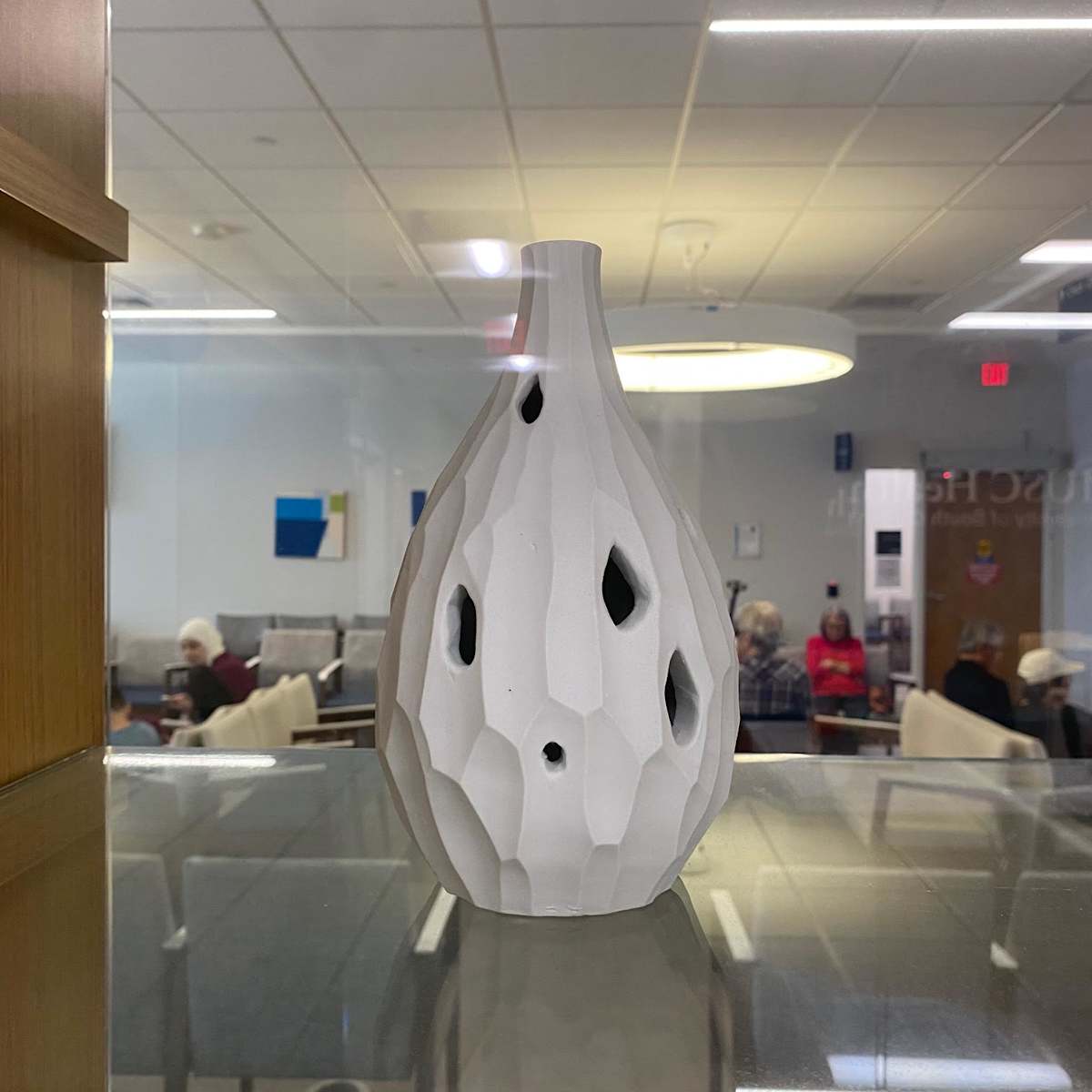 Maria White by Maria White  Image: I am inspired by the forms, textures and patterns that I discover in the natural world. Light is an integral part of my work and I am interested in how it interacts with the objects I create. I explore how light is reflected, absorbed, radiated, and experienced. Working primarily in porcelain, most of my pieces are thrown on the potter’s wheel and carved while other vessels are cast to achieve translucency. I strive to create work that celebrates both form and function. 

For this exhibition, I chose "Raw Bottle" ; it is a piece that, while both minimal and elegant, has openings or windows into the form that suggest detritus and invites the viewer to take a deeper look into the vessel and notice where light plays. As human beings, we all have wounds, scars and evidence of pain; some are visible and some are not. Despite this, we are stronger than we realize and have radiance within us, always. I hope this can serve as a reminder to ask for help if you are in pain and shine on.