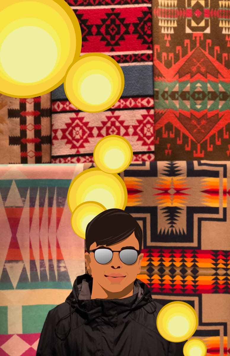 Mijo At The Mac  Image: Mijo at the MAC is a portrait of my son standing infant of several Native American blankets. He is a brown boy learning his Indigenous Mexica heritage, Mexican culture while embracing his American culture. As hyphenated Americans, we are often called immigrants, we are labeled as a minority and often identified as disadvantaged. We are the native Americans that aren't apart of the 1924 Native American Act to have citizenship in the U.S. because our indigenous roots are older than the U.S., older than Mexico and date back before the first time we were colonized by Spain in the early 1500s. My son was born in a city that's older than the U.S. and still not an American. We are hyphenated Mexican - Americans to the U.S. government. Called hispanic, Latino, Latina and now Latinx or Latine to be gender inclusive. Actually we are more American than U. S. Americans. We are native Americans. (Click the purchase link for size options)