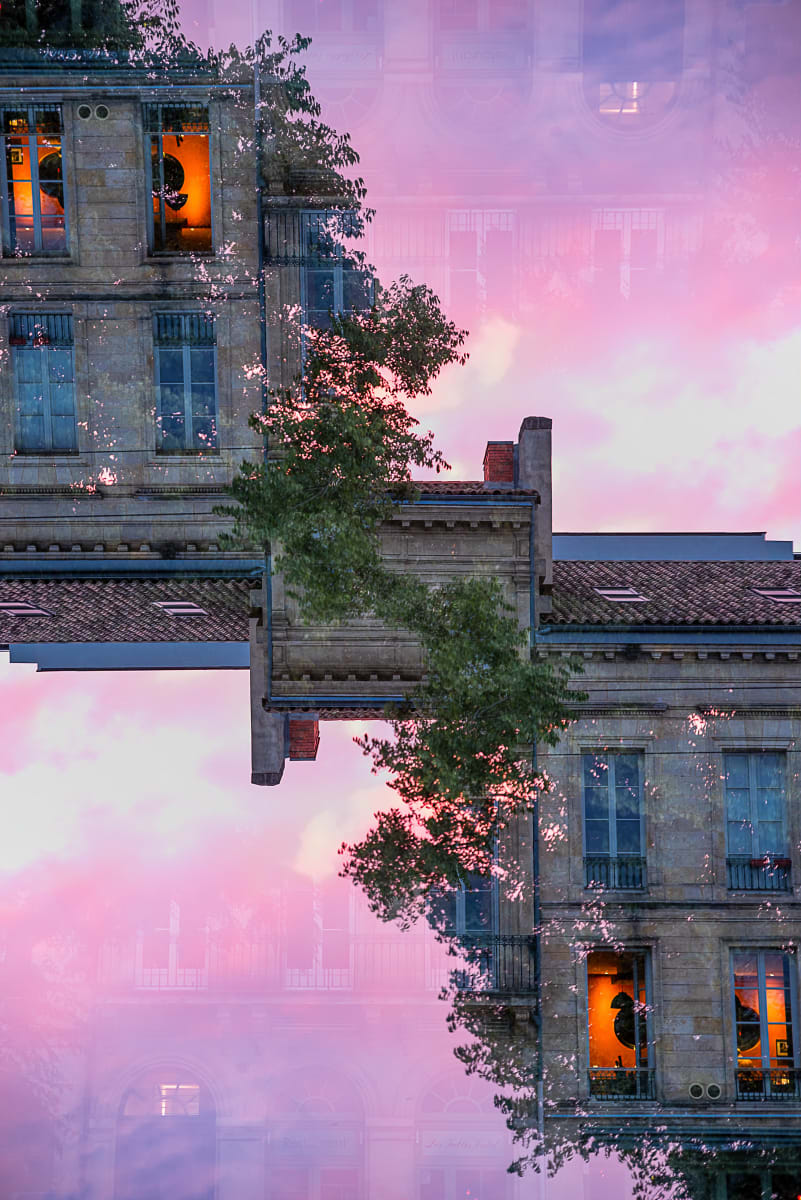 BORDEAUX #80 by Robin Vandenabeele  Image: Apartment block in Bordeaux, France under a pink evening sky.