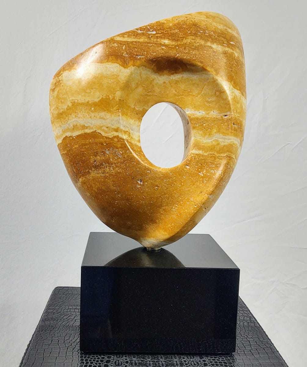 Persian Sunset by Scott Gentry Sculpture  Image: Scott Gentry Sculpture. "Persian Sunset" front view. Persian yellow travertine on black marble base. Measures 15H x 7W x 7D inches.