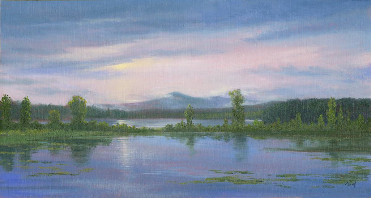 Sun breaking through over Ggll Pond.  ADKS by Tarryl Gabel 