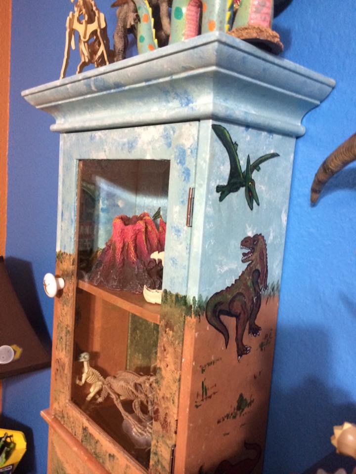 Dinosaur themed wall cabinet by Heather Medrano 