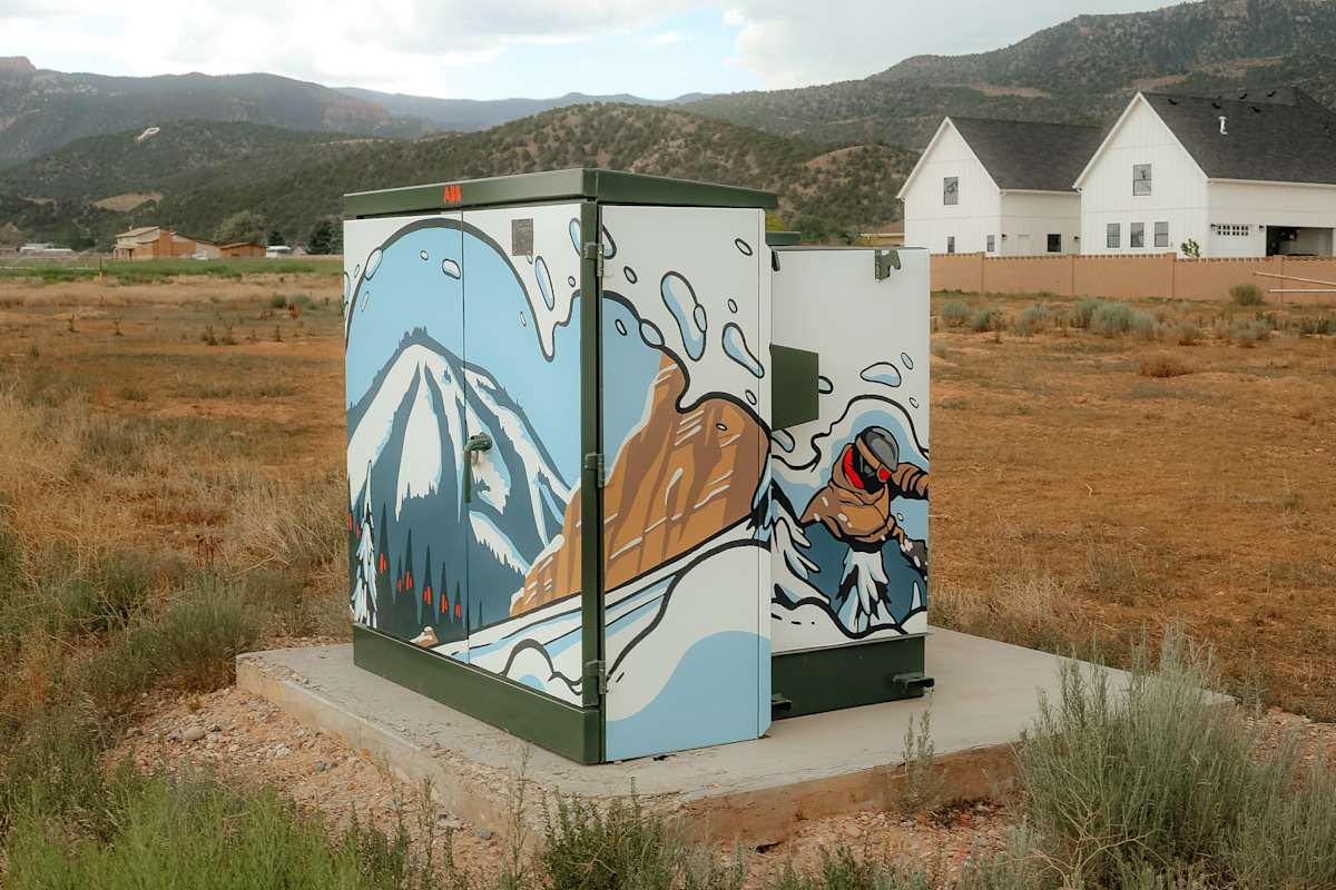 Utility Box Wrap (Skier) by Adrianna Allegretti  Image: 1070 W 200 S, Parowan, UT.

Photograph by Ryann S. Ford. Licensed by Creative Commons (CC  BY-SA). 