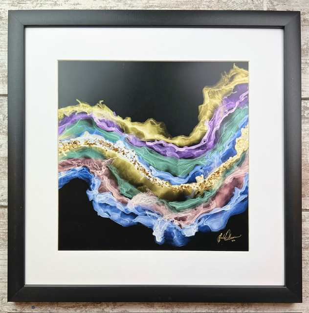 At First, Just Ghostly by Julie Olson  Image: Abstract  painting, created using color-shifting Chameleon alcohol inks & gold mica on black synthetic paper, 12” x 12”.  Titled “At First, Just Ghostly”, the art was debuted at the Pekin Days Art Show, Pekin ND, where it won a first place award in Painting-Other category, June 2023. It was then accepted into the joint Arts for Vets/UND Art Collections year-long exhibit, where it won the Colonel Eugene Myers Purchase Award 2023, and it will displayed in the UND President’s Collection and a have a permanent place in UND Art Collections, University of North Dakota, Grand Forks, ND.