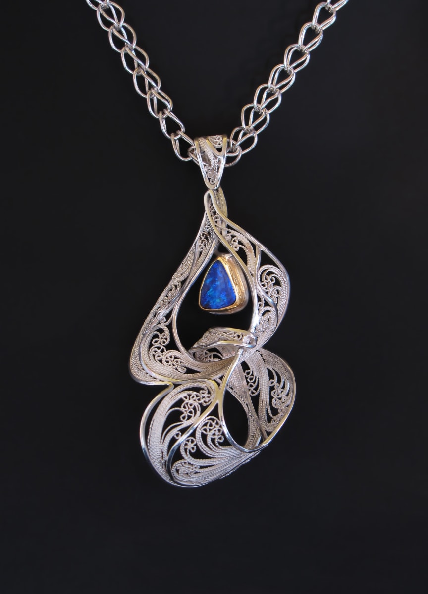 Entwine VI by Victoria Lansford  Image: 3D Filigree pendant, formed from a single sheet of tension-fitted (Russian) filigree, on a loop-in-loop chain
