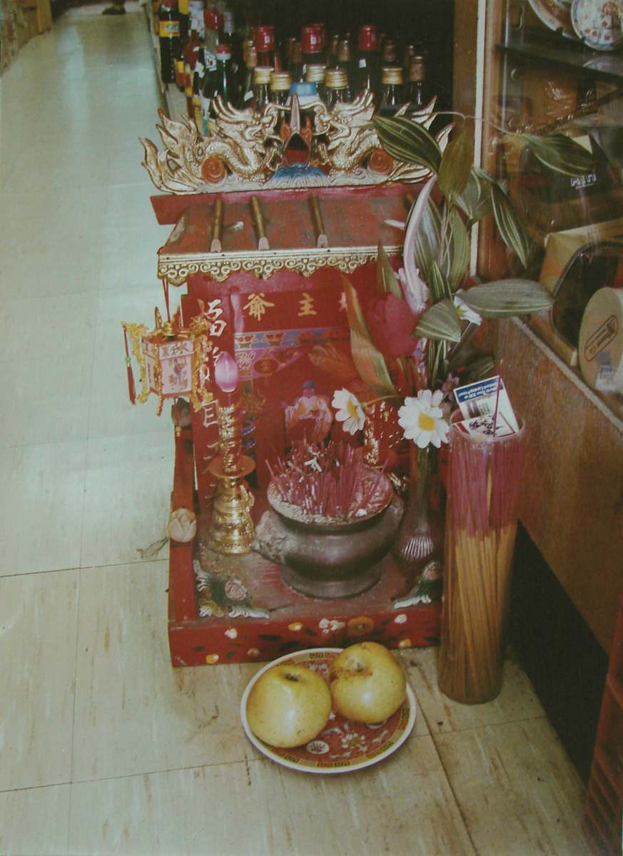 Rochester Asian market: Floor altar, Rochester, New York by Marion Faller 