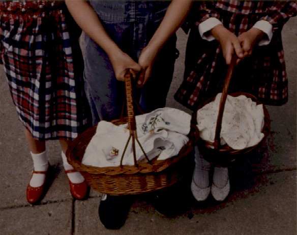 Swienconka:2 girls in plaid,boy in jeans w/baskets by Marion Faller 