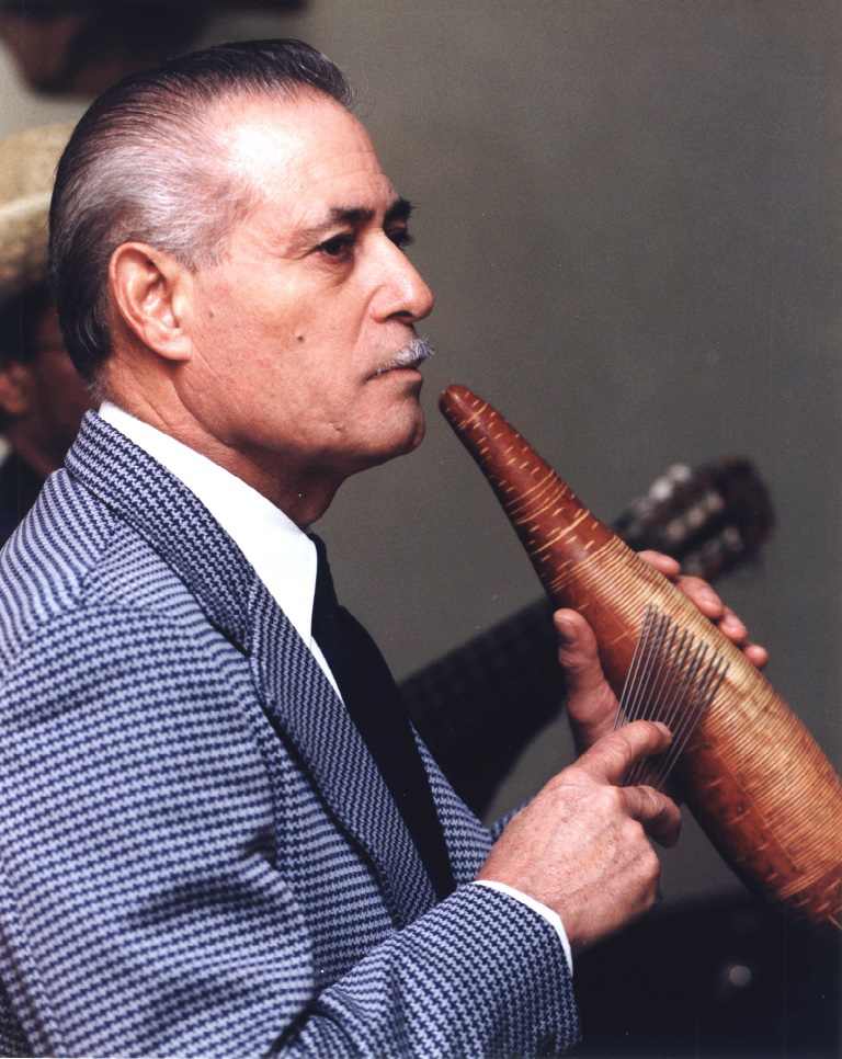 Man Playing Guiro by Charles Agel 