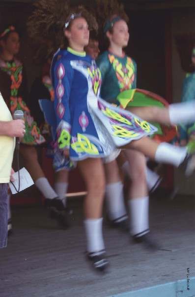 Two dancers high kicking by Jim Bush 