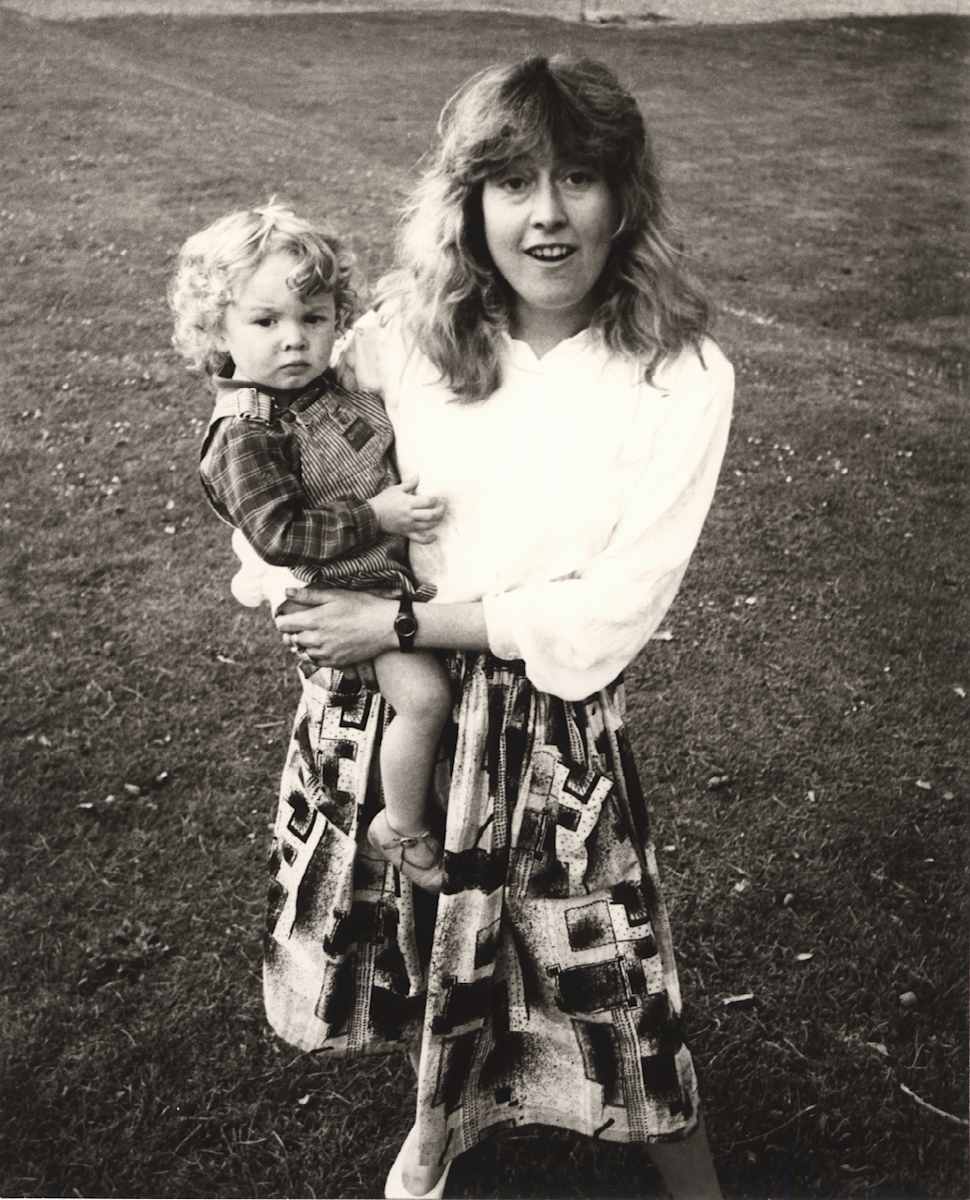 Catherine Guinness holding a Child by Andy Warhol 