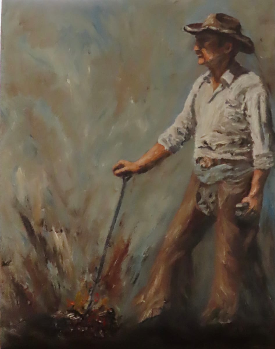 Branding Iron by Alexandra Verboom Fritz  Image: ‘Branding Iron’ is an original oil painting by Alexandra Verboom Fritz featuring a cowboy standing at the ready waiting for the next calf to be drug into the branding trap. He holds a branding iron in the fire with one hand and a tagging gun with the other