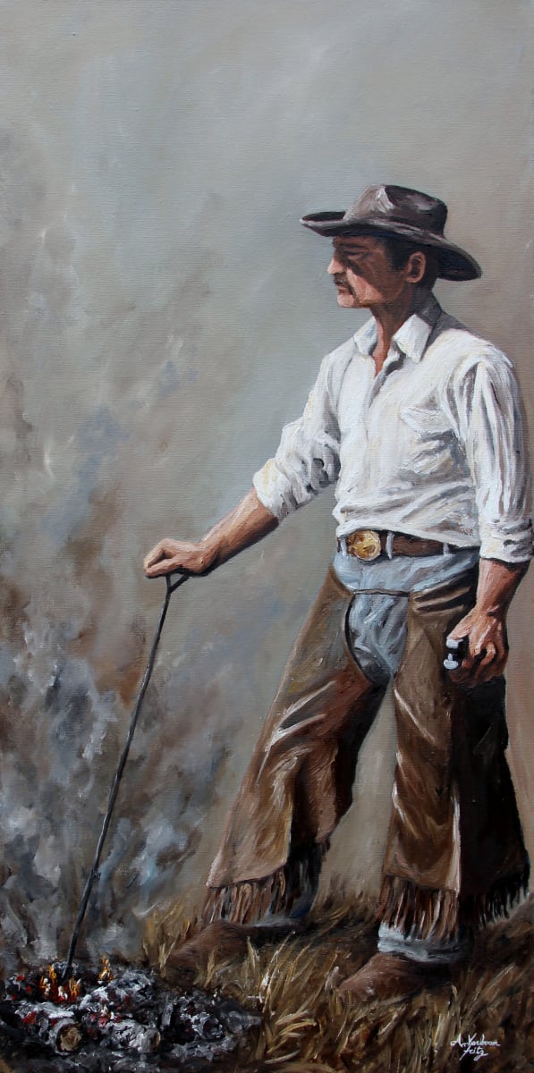 Smoke and Iron by Alexandra Verboom Fritz  Image: ‘Smoke and Iron’ is an original oil painting by Alexandra Verboom Fritz featuring a cowboy standing at the ready waiting for the next calf to be drug to the fire for branding. He holds a branding iron in the fire with one hand and a tagging gun with the other. 
This original cowboy painting will be available at the Pure West Art & Artifact Auction on June 9, 2024. For more info or to buy your tickets visit https://purewestartauction.com/