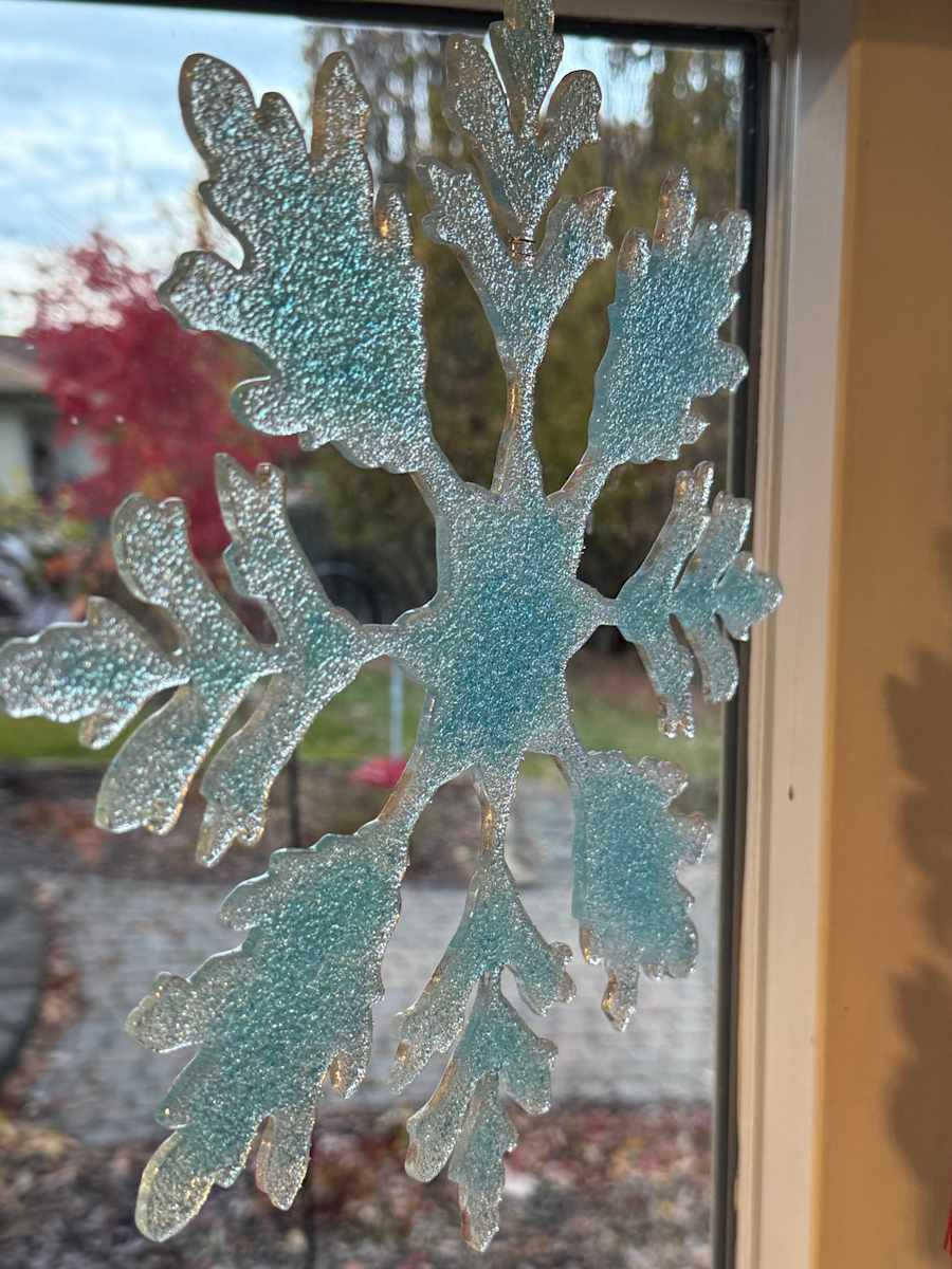 Snowflake Window Ornament, 11-3/4", color will vary by Nancy Gong  Image: Snowflake window ornament 11-3/4", various colors.
Available at Pittsford Fine Art or art the studio by appt.