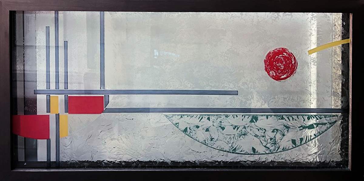 Bringing it Together (Geo Plan) by Nancy Gong  Image: Shown in horizontal format, hand chipped etched and painted glass. Background is mainly transparent. Photo is taken against a wall.