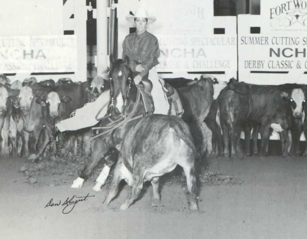 Hustling On  Image: Hustling on shown by Lauri Mills at the 1991 NCHA Summer Spectacular.