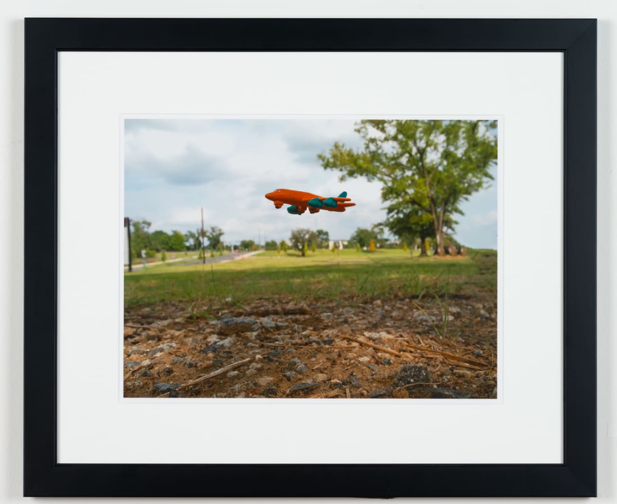 Inches Above Earth Series "Approximate Altitude 8.0 Inches " (Orange Plane over Grass) by Michael Reese 