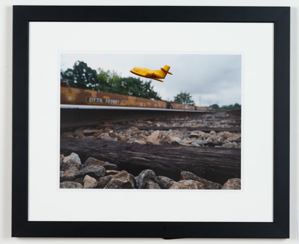 Approximate Altitude ? Inches, Inches Above Earth Series (Yellow Jet Over Railroad Track) by Michael Reese 