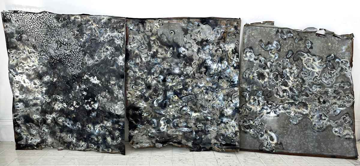 Blowtorch drawing on antique zinc roofing. Triptych by Marieken Cochius  Image: Blowtorch drawing on antique zinc roofing. Triptych