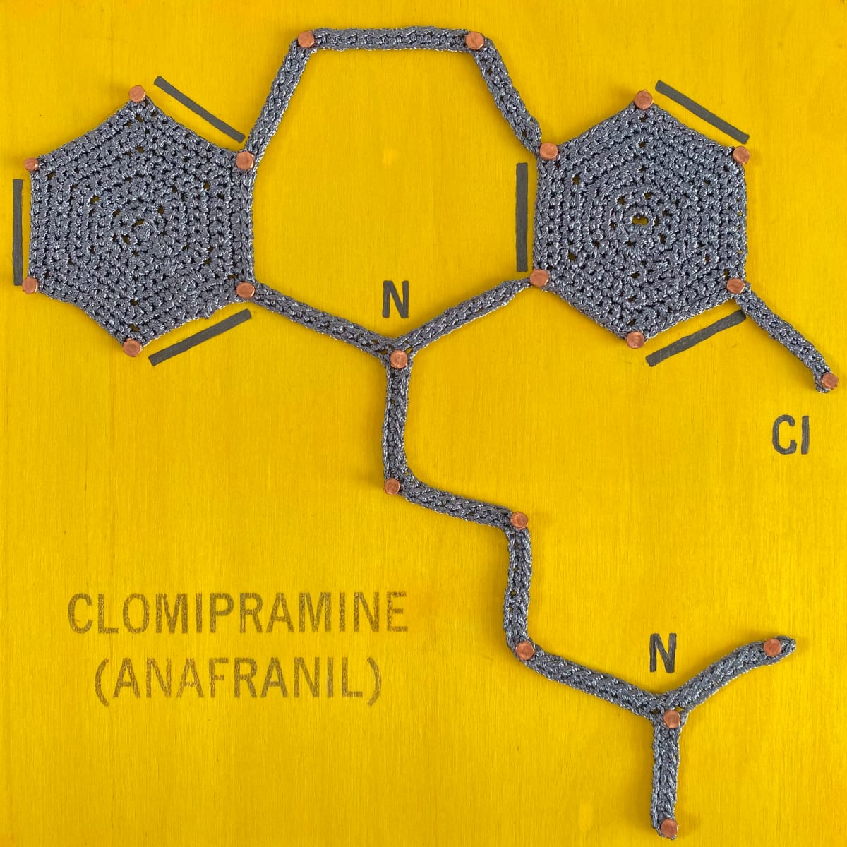 Take 'Em If You Need 'Em: Clomipramine (Anafranil)  Image: Part of the Balancing Act series highlighting how chemical prescriptions, behavioral therapies as well as art and crochet are methods to obtaining better mental and physical health. This piece focuses on the chemical element compound Anafranil, used in the treatment of obsessive-compulsive disorder.