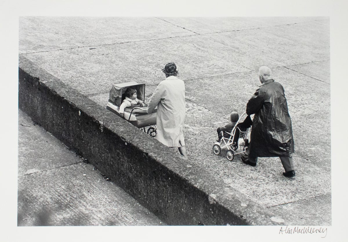 Older Couple Walking with Children, Dublin by Alen MacWeeney 