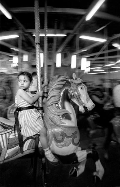 Gypsy Girl with Merry-Go-Round, Coney Island, NY, from Photographer's Choice: Harold Feinstein-Decades Four by Harold Feinstein 