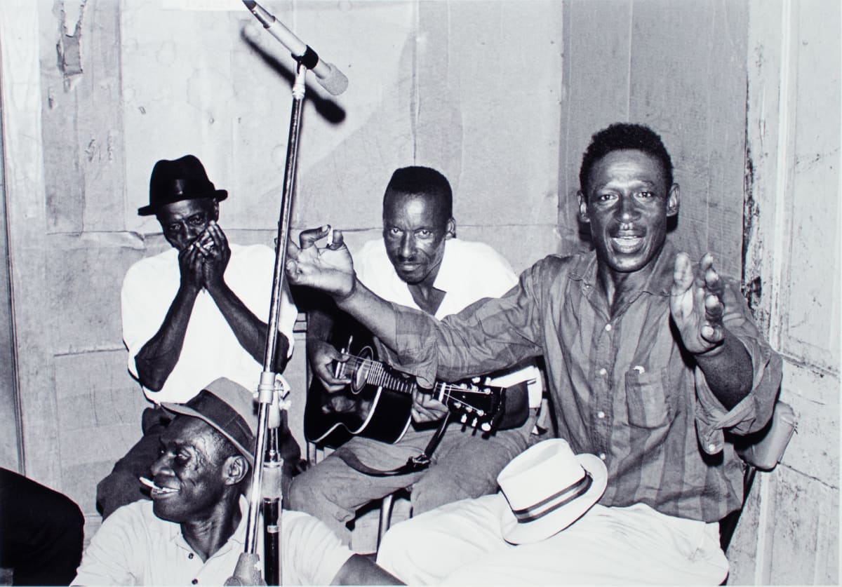 (left to right) "Little Son" Jefferson, James "Son Ford" Thomas, Gussie Tobe, and "Moon Shine" (seated), Leland by William R. Ferris 