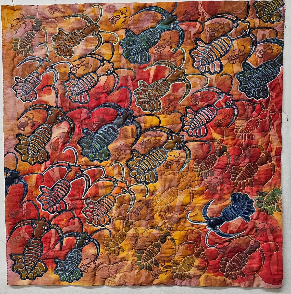 In the Burgess Shale by Vicki Conley  Image: In a recent trip to Canada I learned of the fossils of the soft bodied creatures in the Burgess Shale. This is a unique area as most fossils found around the world are from bone and shell.  Artists render a depiction of these creatures based on many partial fossils and try to extrapolate what a 3D creature might actually look like. The creatures on this piece were drawn by me from some fossil images. 
