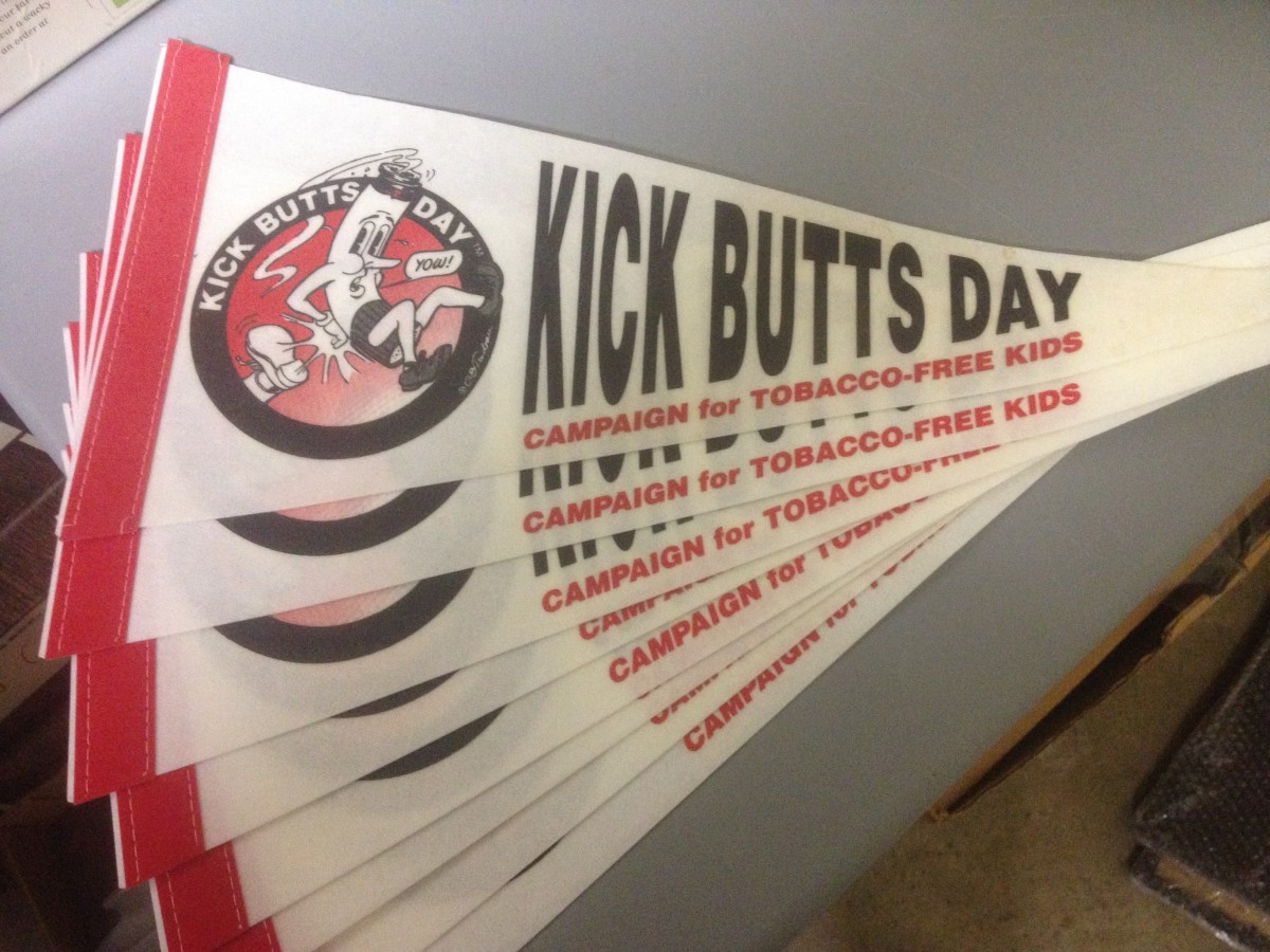 "Kick Butts Day" -- Pennant by Garry Trudeau 