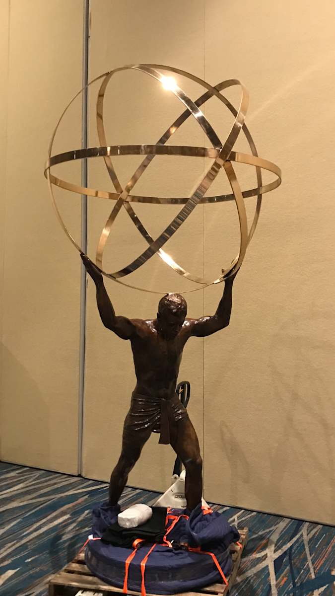 MAN WITH SPHERE-HALF LIFE SIZE by JACINTHE LACROIX. MASTER SCULPTOR AND ARTIST 