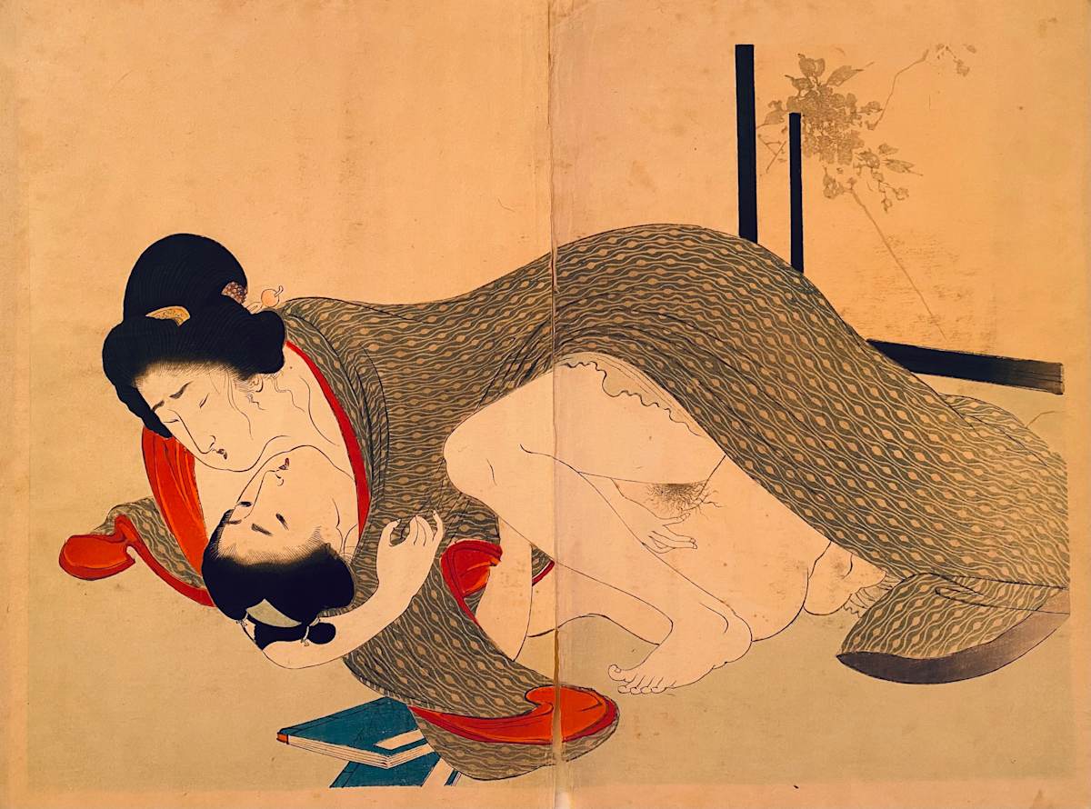 Couple under a grey blanket 