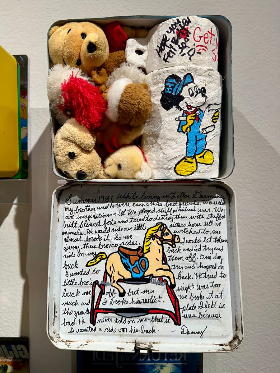 It’s a miracle we survived as kids, No.3 “My turn” by Dan45 Hernandez  Image: Dan45 Hernandez
It’s a miracle we survived as kids, No.3 "My turn" Detail view, Marjorie Barrick Museum of Art
Vintage lunch box, plaster cast, stuffed animals, Posca acrylic paint markers

