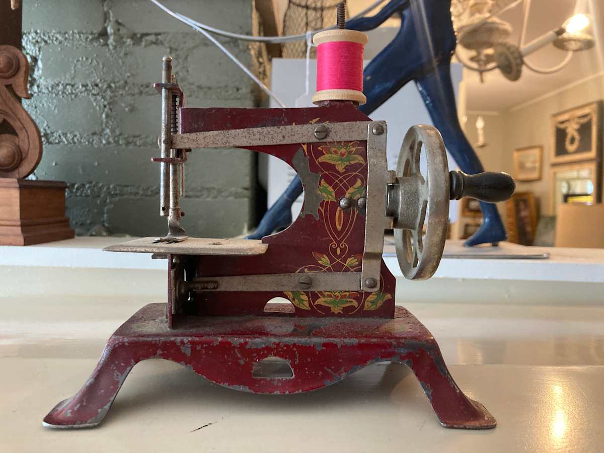 Red vintage toy sewing machine 